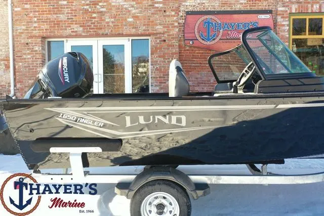 Slide: The Image of 2024 Lund 1650 Angler Sport boat on trailer at Thayer's Marine. - 5
