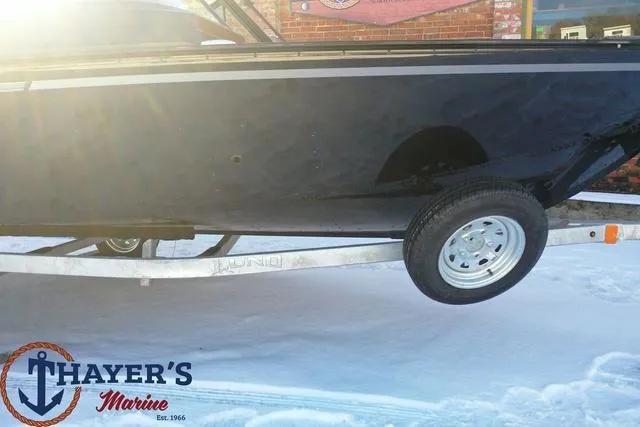 Slide: The Image of 2024 Lund 1650 Angler Sport boat on trailer at Thayer's Marine. - 8