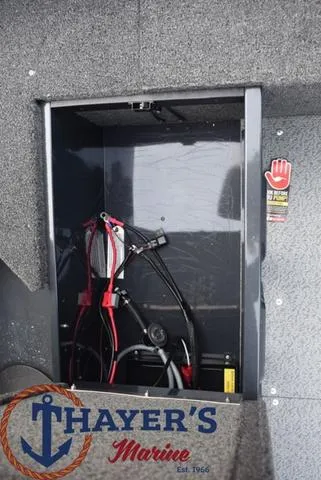 Slide: The Image of 2024 Lund 1650 Angler Sport boat storage compartment at Thayer's Marine. - 16