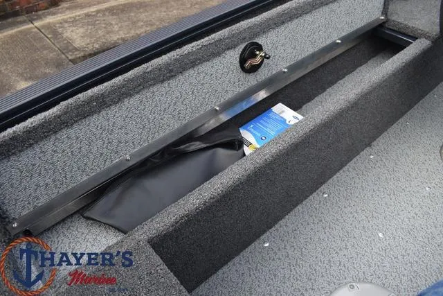 Slide: The Image of 2024 Lund 1650 Angler Sport boat interior storage compartment at Thayer's Marine. - 18