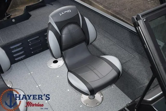 Slide: The Image of 2024 Lund 1650 Angler Sport boat interior with Thayer's Marine logo. - 22