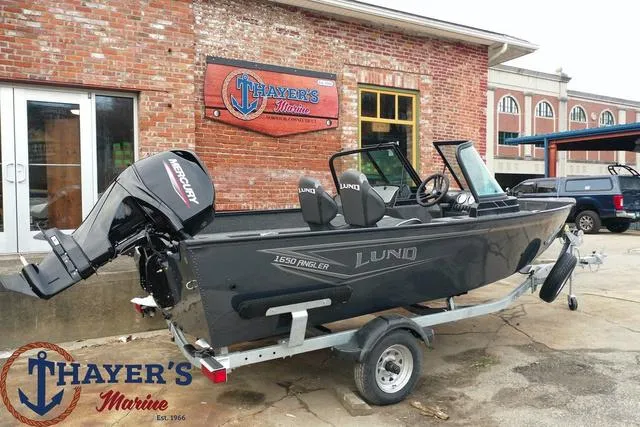 Slide: The Image of 2024 Lund 1650 Angler Sport boat on trailer at Thayer's Marine. - 24