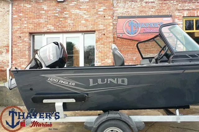 Slide: The Image of 2024 Lund 1650 Angler Sport boat on trailer at Thayer's Marine. - 5