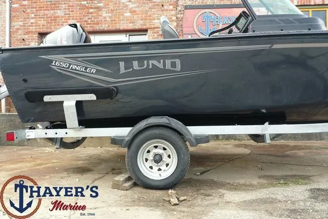 Slide: The Image of 2024 Lund 1650 Angler Sport boat on trailer at Thayer's Marine. - 6