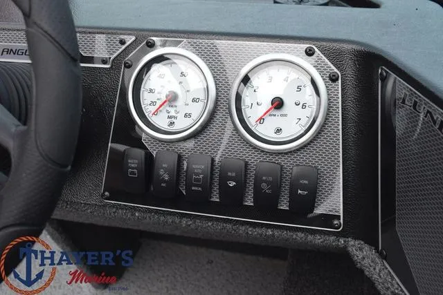 Slide: The Image of 2024 Lund 1650 Angler Sport dashboard with speedometer and tachometer gauges. - 9
