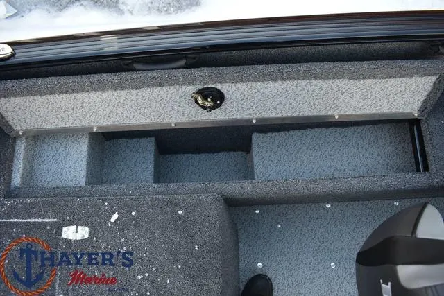 Slide: The Image of 2024 Lund 1650 Rebel XL Sport boat interior storage compartments. - 11