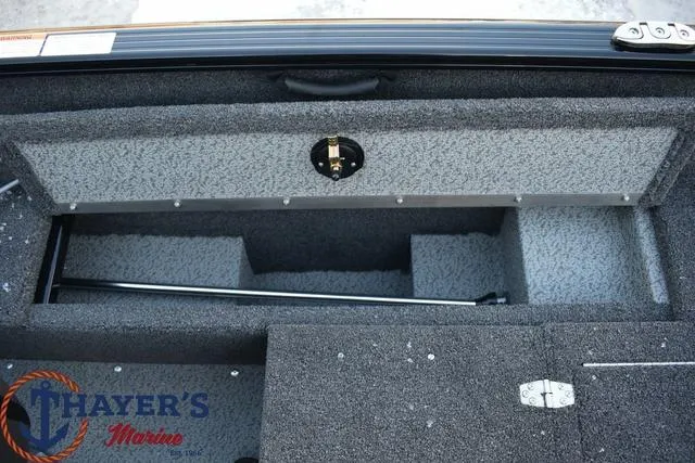 Slide: The Image of 2024 Lund 1650 Rebel XL Sport boat storage compartment. - 12