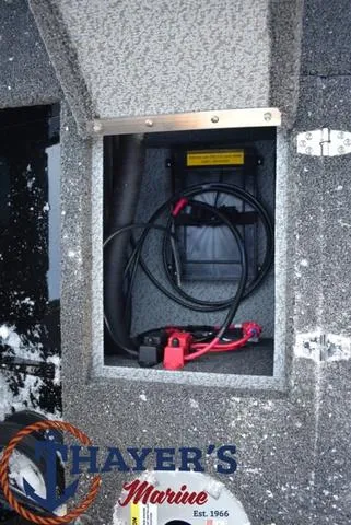 Slide: The Image of 2024 Lund 1650 Rebel XL Sport battery compartment at Thayer's Marine. - 13