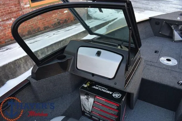 Slide: The Image of 2024 Lund 1650 Rebel XL Sport boat interior with Mercury Marine box. - 15