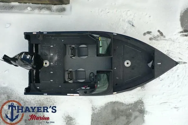 Slide: The Image of 2024 Lund 1650 Rebel XL Sport boat on snow, top view, Thayer's Marine logo. - 20