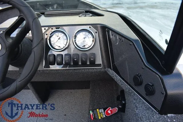 Slide: The Image of Dashboard of 2024 Lund 1650 Rebel XL Sport boat with gauges and controls. - 5