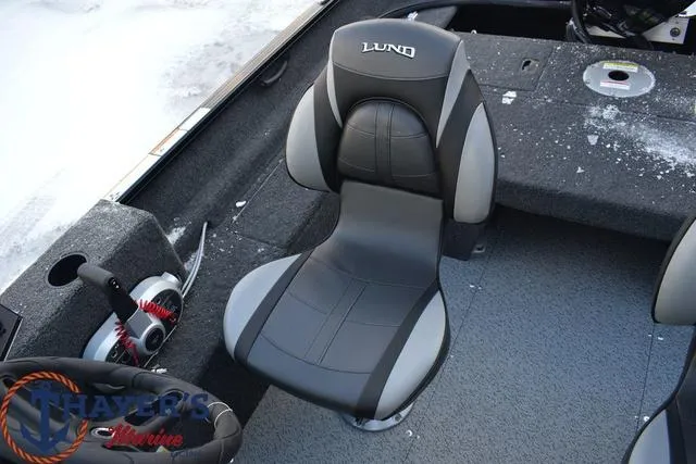 Slide: The Image of 2024 Lund 1650 Rebel XL Sport boat interior with comfortable seating. - 6
