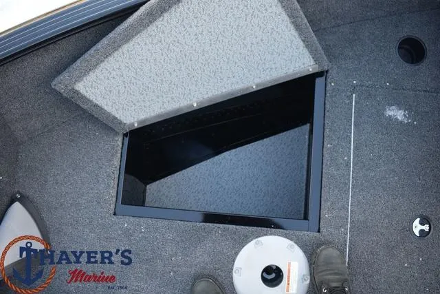 Slide: The Image of 2024 Lund 1650 Rebel XL Sport boat storage compartment at Thayer's Marine. - 9