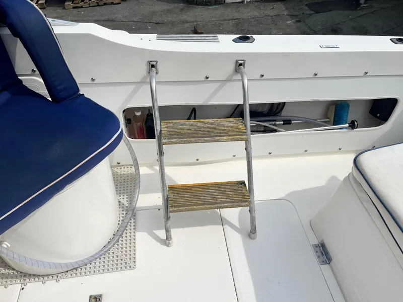 Slide: The Image of 1977 Bertram 26 Moppie boat interior with ladder and blue seating. - 15