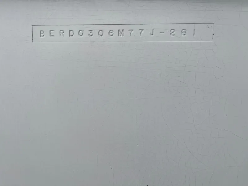 Slide: The Image of Hull identification number on 1977 Bertram 26 Moppie boat. - 27