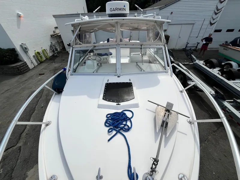 Slide: The Image of 1977 Bertram 26 Moppie boat with Garmin equipment, docked and ready for use. - 7