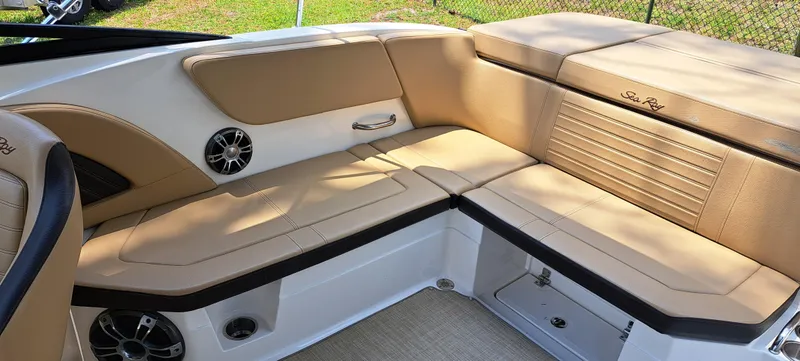Slide: The Image of 2019 Sea Ray SPX 230 OB boat interior with tan leather seating. - 26