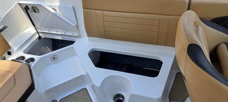 Slide: The Image of 2019 Sea Ray SPX 230 OB boat interior storage compartments and seating. - 36