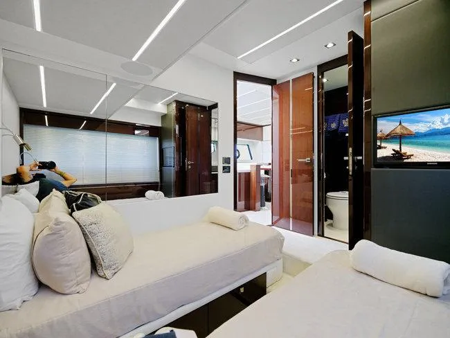 Slide: The Image of Luxurious bedroom interior of 2018 Sunseeker Predator 74 yacht with modern amenities. - 11