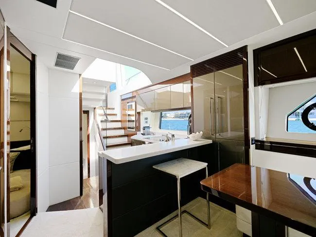 Slide: The Image of Luxurious interior of 2018 Sunseeker Predator 74 yacht with modern design and ample natural light. - 12