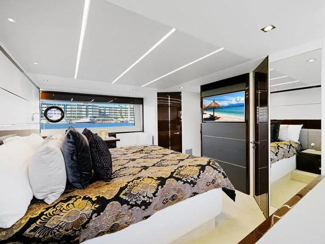 Slide: The Image of Luxurious bedroom interior of 2018 Sunseeker Predator 74 yacht with elegant decor and scenic window view. - 32