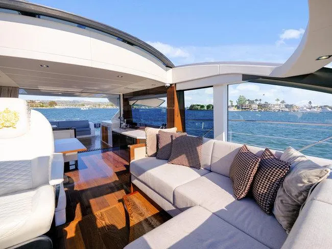 Slide: The Image of Luxurious 2018 Sunseeker Predator 74 yacht interior with plush seating and ocean view. - 48