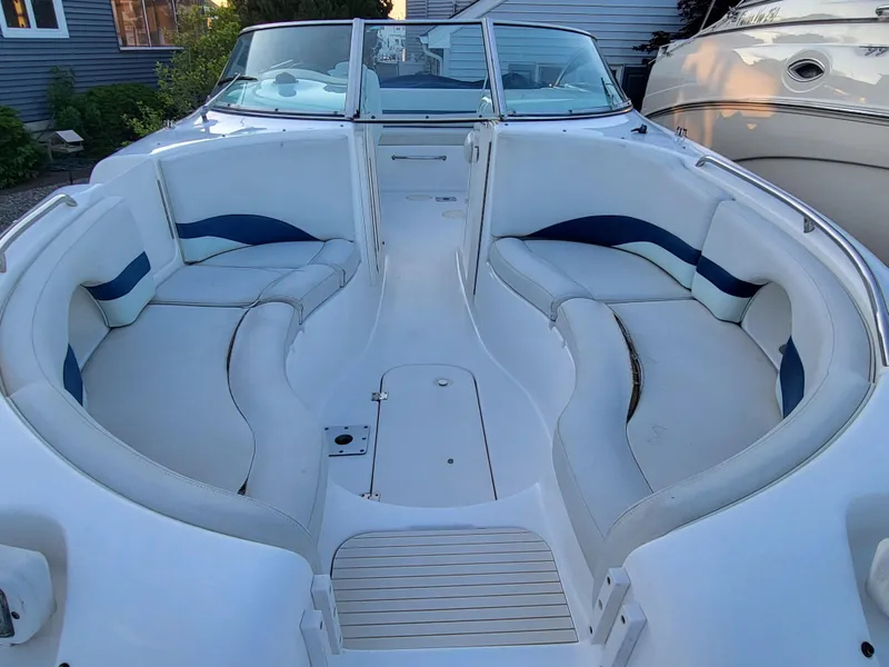 Slide: The Image of 2002 Chaparral Sunesta 233 boat with spacious seating and sleek design. - 16