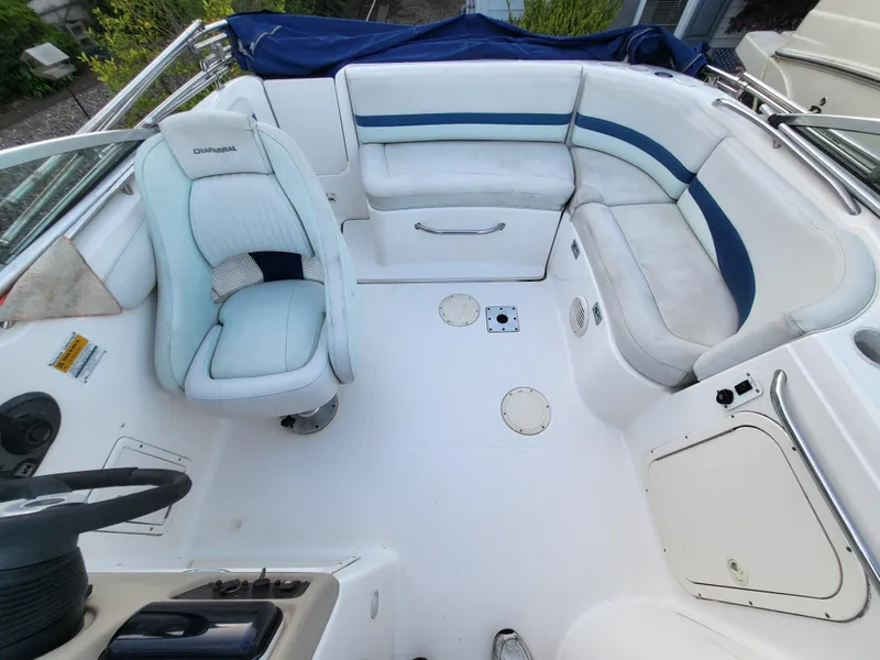 Slide: The Image of 2002 Chaparral Sunesta 233 boat interior with white and blue seating arrangement. - 4
