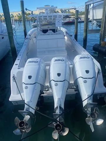 Slide: The Image of 2019 Invincible 39 Open Fisherman with triple outboard engines docked. - 11