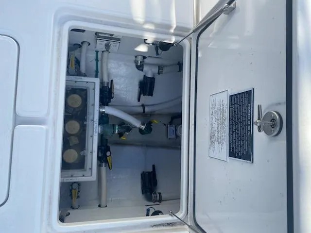 Slide: The Image of 2019 Invincible 39 Open Fisherman boat compartment with plumbing and mechanical components. - 20
