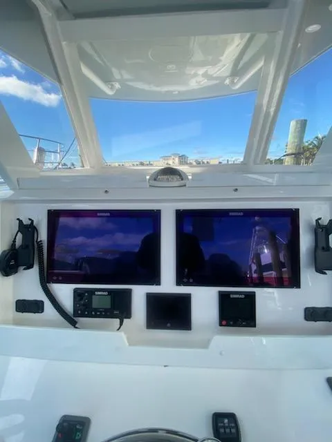 Slide: The Image of 2019 Invincible 39 Open Fisherman helm with dual displays and navigation equipment. - 21
