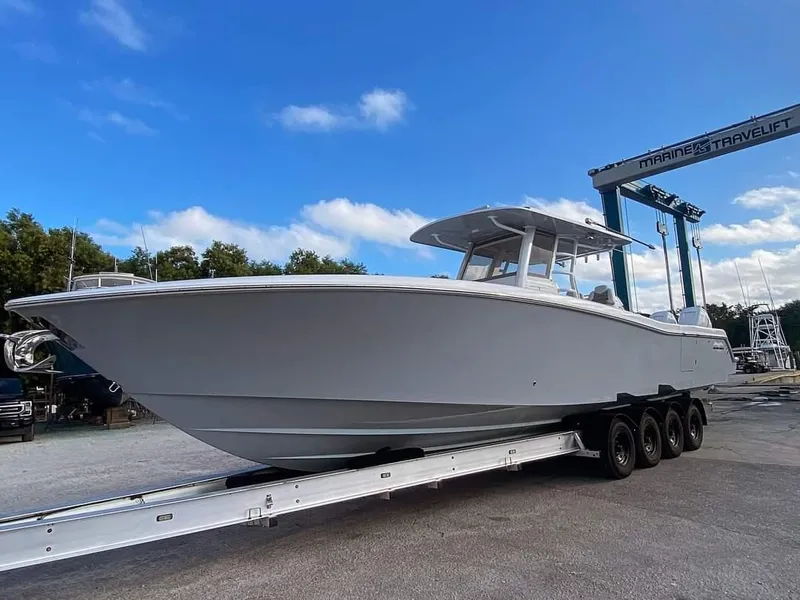 The Image of 2019 Invincible 39 Open Fisherman boat on trailer at marina. - 9