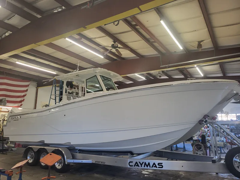 The Image of 2024 Caymas 34 CT boat on trailer in a warehouse. - 0