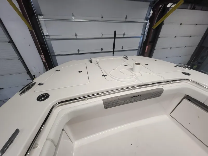 Slide: The Image of 2024 Caymas 34 CT boat interior, white deck and storage compartments. - 19
