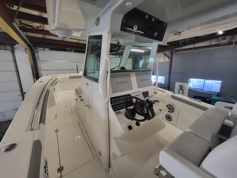 Slide: The Image of 2024 Caymas 34 CT boat interior with Garmin navigation system. - 20