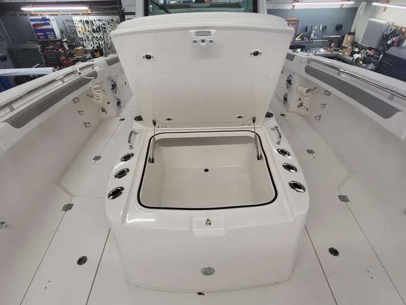 Slide: The Image of 2024 Caymas 34 CT boat with open storage compartment in the deck. - 21