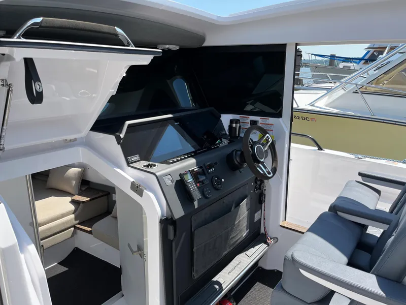 Slide: The Image of 2020 Axopar 37 XC cockpit with modern navigation system and seating. - 21