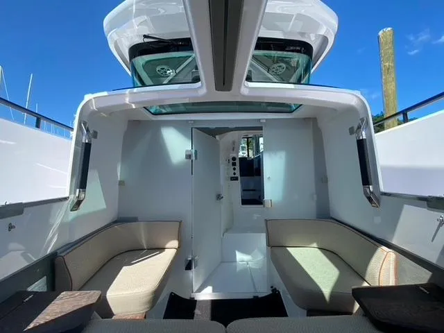 Slide: The Image of Interior of 2020 Axopar 37 XC boat with seating and skylight. - 24