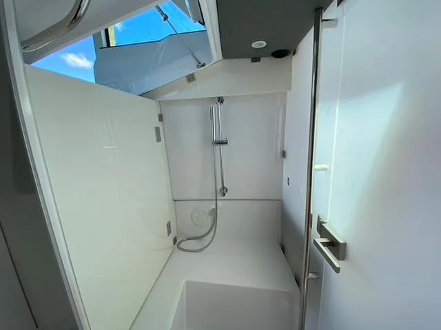 Slide: The Image of Modern bathroom in 2020 Axopar 37 XC boat with sleek white design. - 17