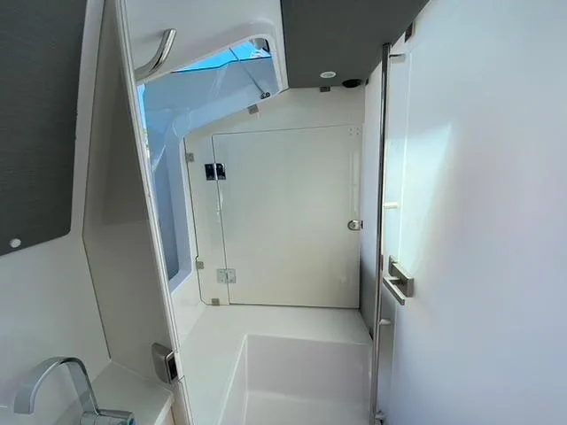 Slide: The Image of Interior cabin of 2020 Axopar 37 XC boat with modern white design. - 16