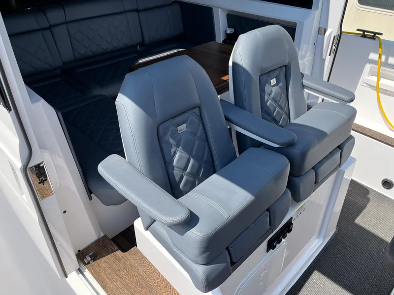 Slide: The Image of Luxury seating on the 2020 Axopar 37 XC boat, featuring plush, quilted upholstery. - 25
