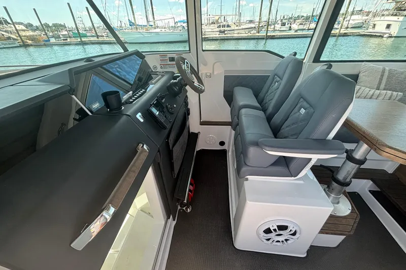 Slide: The Image of Interior of 2020 Axopar 37 XC Cross Cabin with modern helm and seating. - 26