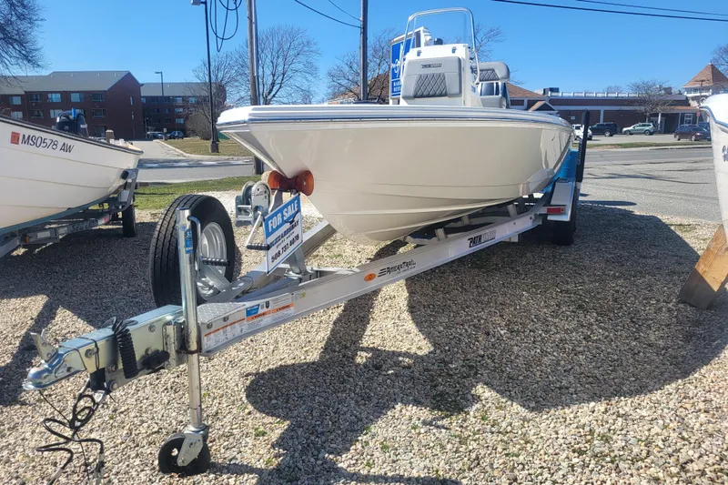 The Image of 2024 Pathfinder 2200 TRS boat on trailer, for sale in outdoor lot. - 0