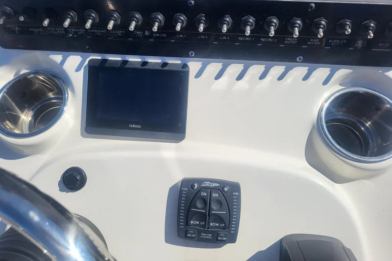 Slide: The Image of 2024 Pathfinder 2200 TRS boat dashboard with controls and Yamaha display. - 10