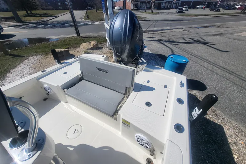 Slide: The Image of 2024 Pathfinder 2200 TRS boat with Yamaha engine, docked on a sunny day. - 11