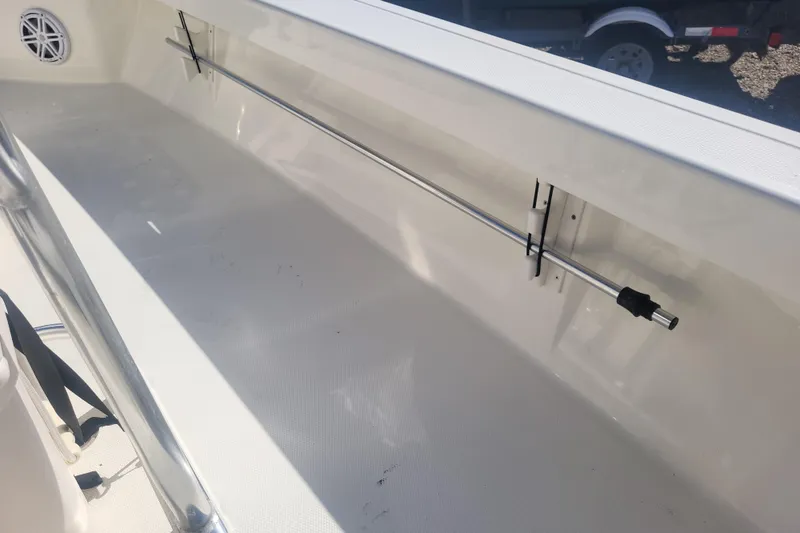 Slide: The Image of 2024 Pathfinder 2200 TRS boat interior with rod holder and clean white deck. - 20