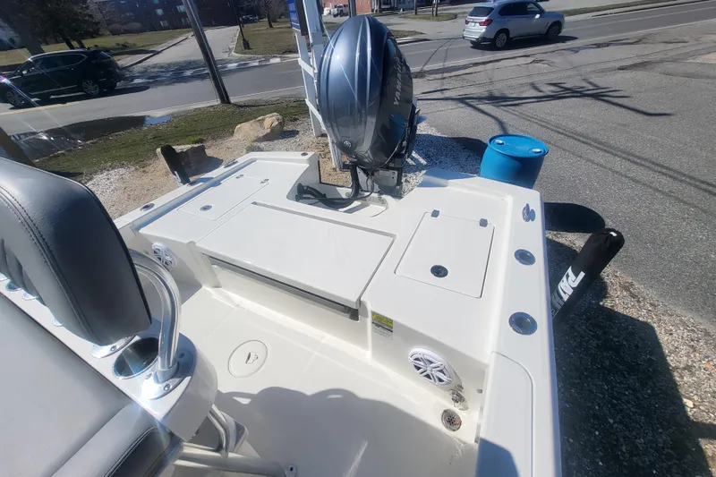 Slide: The Image of 2024 Pathfinder 2200 TRS boat with Yamaha outboard motor, parked on a street. - 26