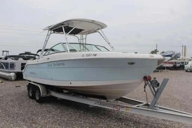 Slide: The Image of 2015 Robalo R247 boat on trailer, named Sea Señora, parked in a lot. - 3