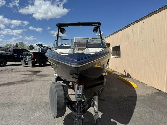 Slide: The Image of 2017 Tigé Z3 boat on trailer, parked outdoors under blue sky. - 3