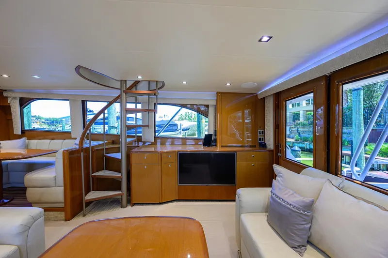 Slide: The Image of Luxurious interior of 2004 Viking 65 Enclosed Bridge yacht with spiral staircase. - 12